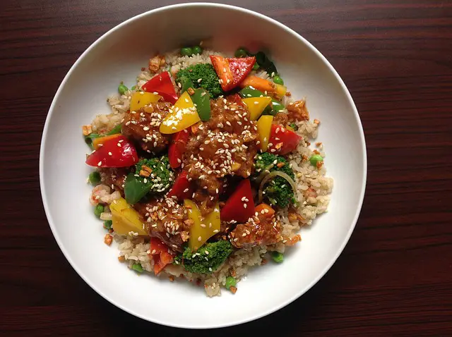 Fried rice with chicken, stir-fry veggies, and eggs.